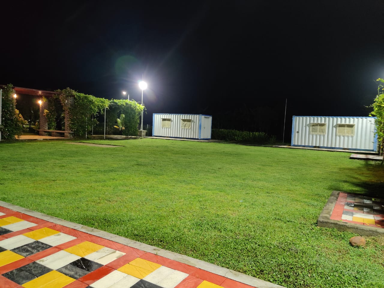 Smiling young girl enjoying flowers in a garden at Sreyes Farm